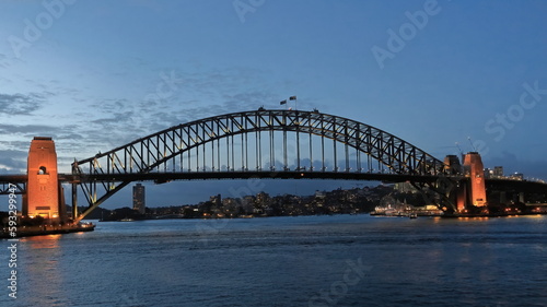 Sydney Harbour Bridge-arch and pylons-viewed from the Opera House at twilight under floodlight. NSW-Australia-585