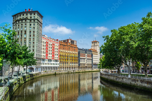 Nervion river embankment in Bilbao. High apartment buildings along the Nervion River, Bilbao, Spain. photo