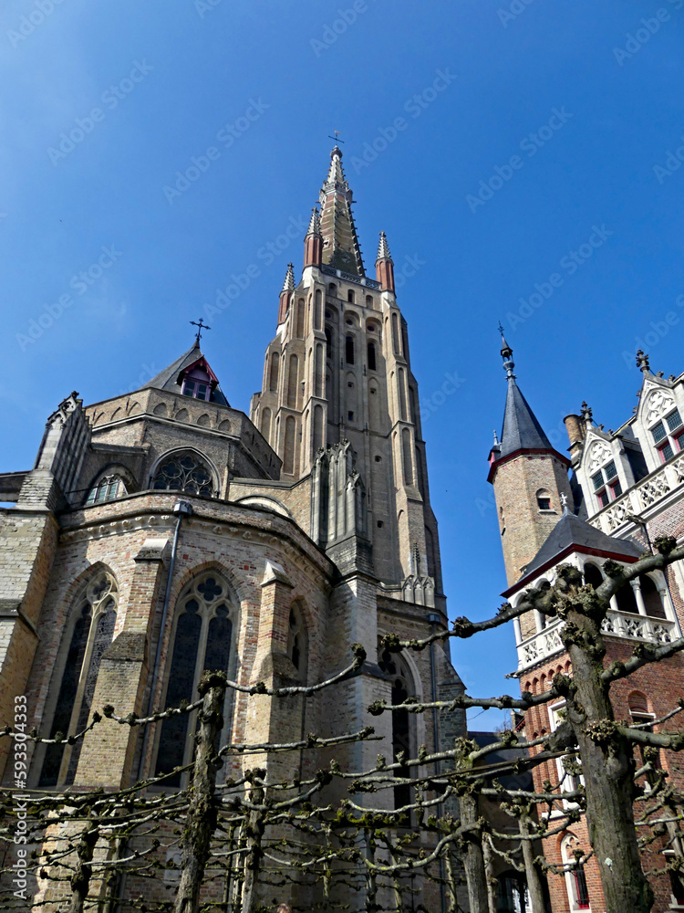 Fototapeta premium Bruges, April 2023: Magnificent facades of the buildings of Bruges, the Venice of the North