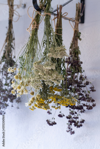 Bundles f medicinal herbs hanging to dry