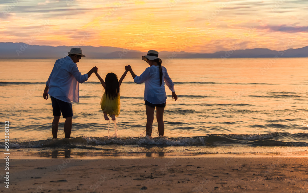 Happy Asian family travel tourist and playing water together having fun and enjoying on beach in summer vacation holiday.