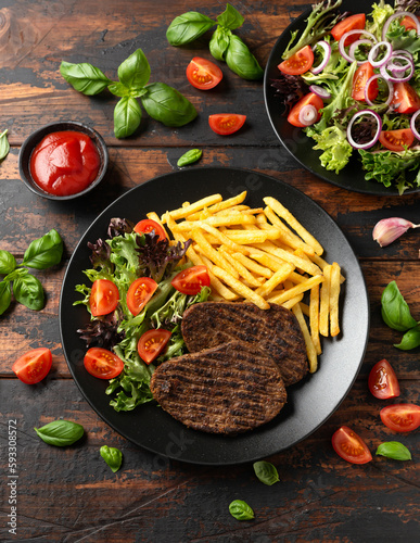 Peppered Vegetarian steaks served with french fries and salad