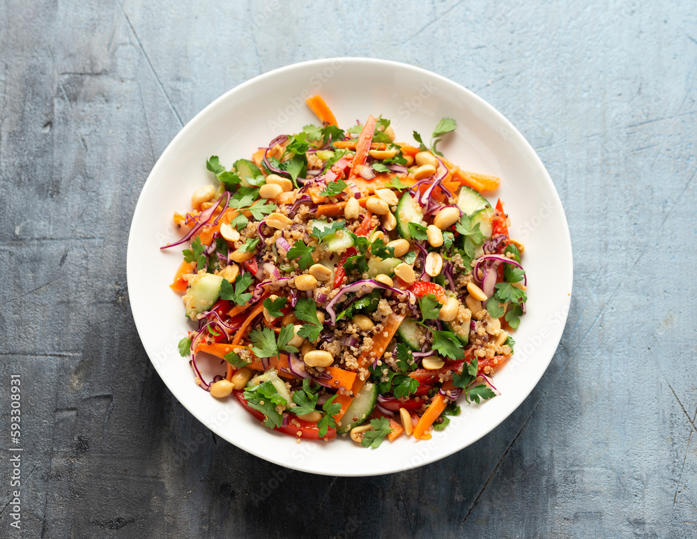 Asian Quinoa salad with fresh vegetables, peanuts and herbs. Healthy food. Asian Quinoa salad with fresh vegetables, peanuts and herbs. Healthy food.