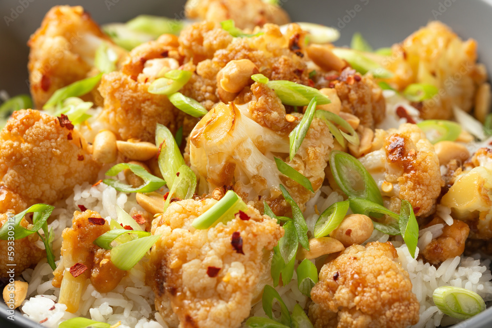 Kung Pao Cauliflower with rice, peanuts and spices. Healthy vegan food. Kung Pao Cauliflower with rice, peanuts and spices. Healthy vegan food.