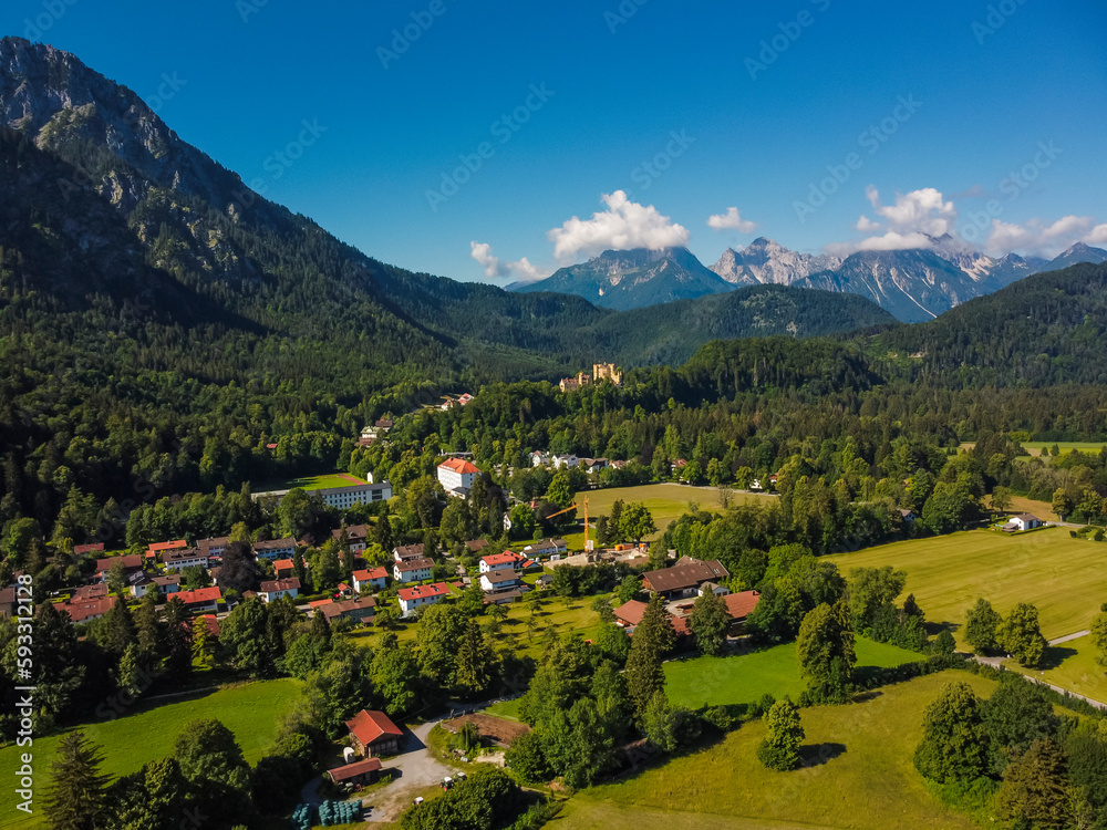 Aerial view castle in Neuschwanstein Fussen, Bavaria, Bayern. Germany by drone. Alps mountains.