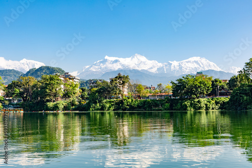 View over The Himalayas from the Phewa lake shore in Pokhara  Nepal.