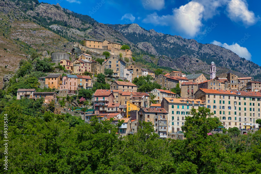 View of the old town of Corte in the heart of Corsica. Corte is located in inland of Corsica surrounded by green forests and the cliffs of Restonica mountains, Corsica island, France View of the old town of Corte in the heart of Corsica. Corte is located in inland of Corsica surrounded by green forests and the cliffs of Restonica mountains, Corsica island, France