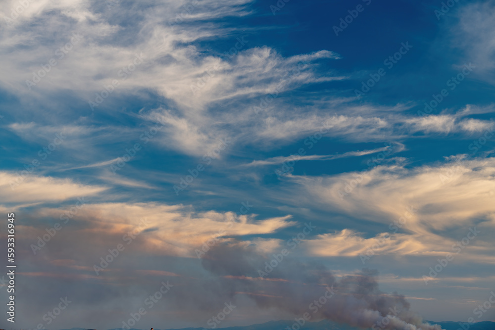 Cloudscape with an active fire burning Cloudscape with an active fire burning