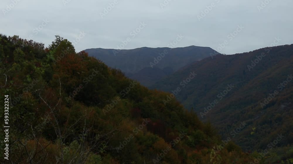 Zoom in into the Mehedinti mountains in Romania during autumn captured in the evening light Zoom in into the Mehedinti mountains in Romania during autumn captured in the evening light