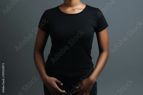 Black woman model wearing a plain black short sleeved t-shirt, isolated on a blank background. Mock-up, torso only. Generative AI illustration. photo