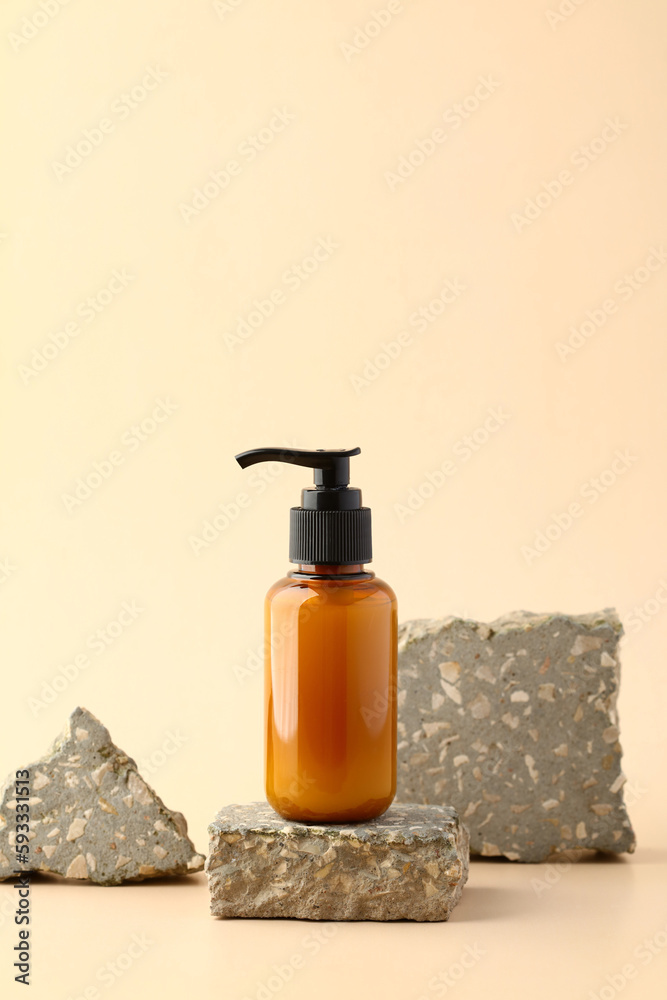 Shampoo dispenser bottle on stone podium. Natural beauty product branding