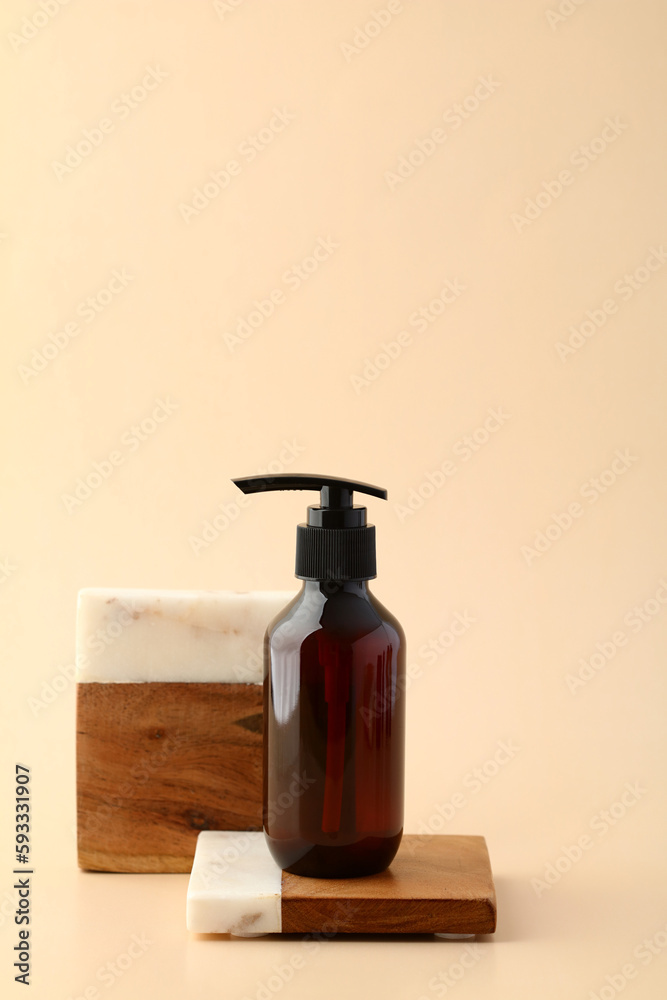 Brown amber glass bottle on podium on beige background. Natural body care cosmetic Brown amber glass bottle on podium on beige background. Natural body care cosmetic