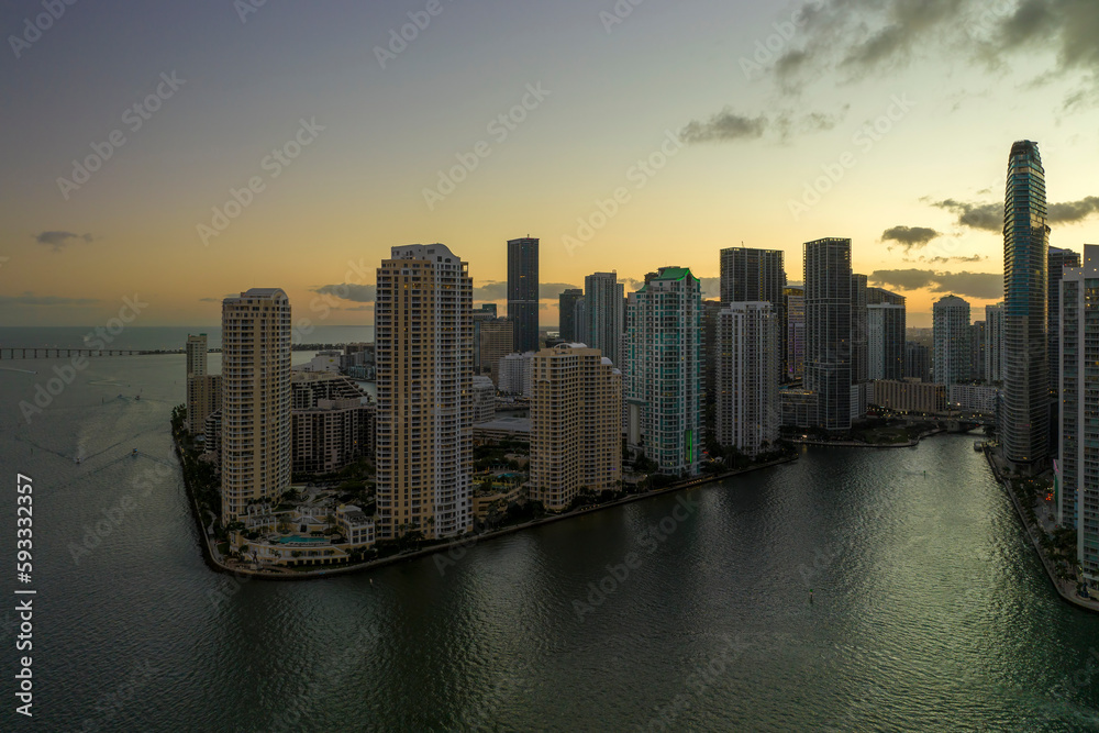 Aerial view of downtown district of of Miami Brickell in Florida, USA at sunset. High commercial and residential skyscraper buildings in modern american megapolis