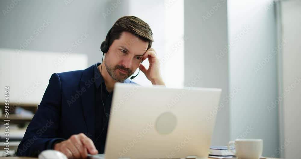 Bored Worried Man With Headset In Videoconference Bored Worried Man With Headset In Videoconference