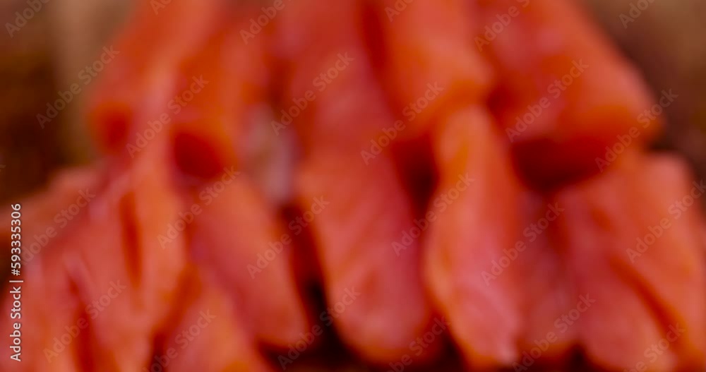 Sliced red trout meat with sea salt, medium-salted pickled red meat from trout and salmon Sliced red trout meat with sea salt, medium-salted pickled red meat from trout and salmon
