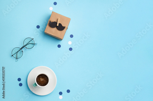Fathers day Card with Gift Box, Moustache, Cup of Coffee and Glasses on Blue Background