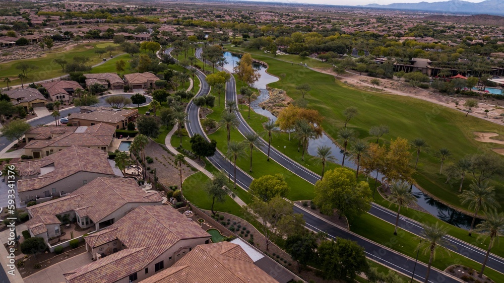 Naklejka premium Aerial drone view of the Trilogy Golf Club on a sunny day
