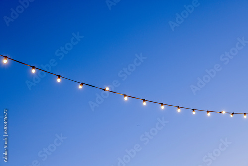 light bulbs garlands against sky