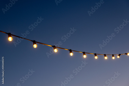 light bulbs garlands against sky