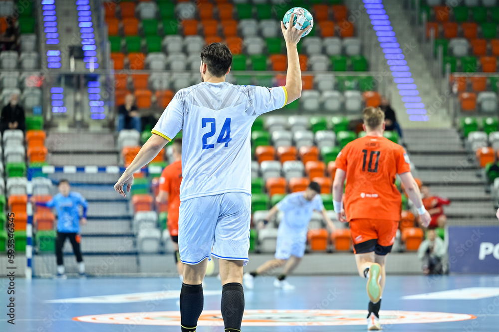 Handball player with ball during handball match.