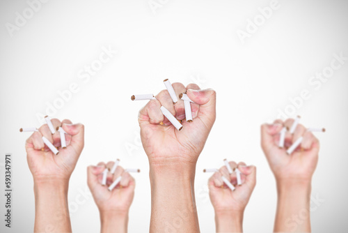 Obraz na plátne Male hand crushing cigarette on gray background