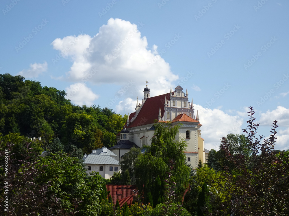 View of the historic Renaissance church on a sunny summer day, Kazimierz Dolny, Poland