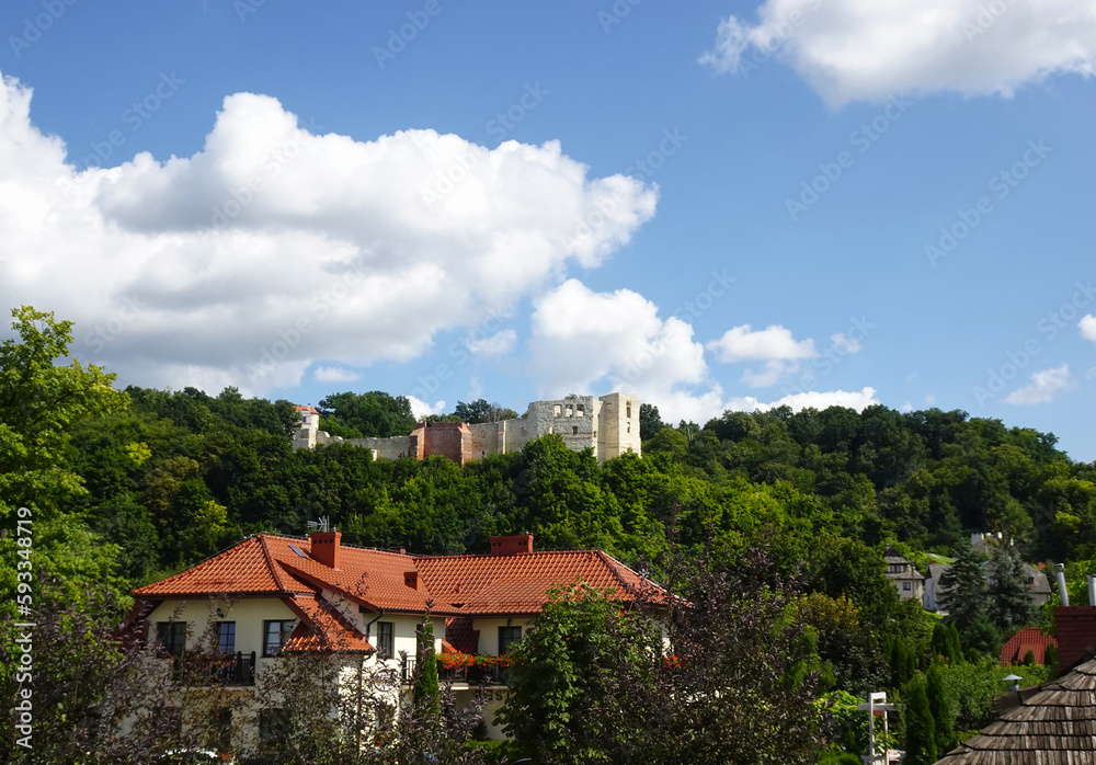 Ruins of a historic castle among trees on a sunny summer day, Kazimierz Dolny, Poland Ruins of a historic castle among trees on a sunny summer day, Kazimierz Dolny, Poland
