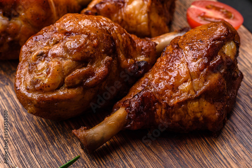 Delicious grilled chicken legs with spices and herbs in teriyaki sauce