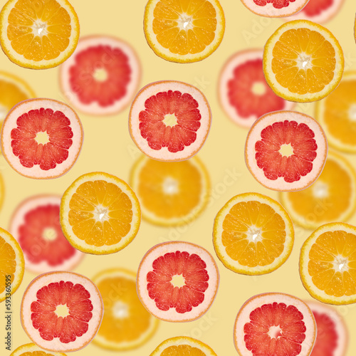 Sliced pieces of orange, lime and grapefruit on a green background. Seamless pattern