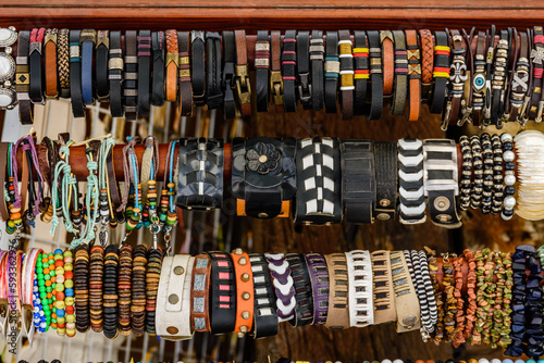 Different wristbands for sale on a street fair © ihorbondarenko