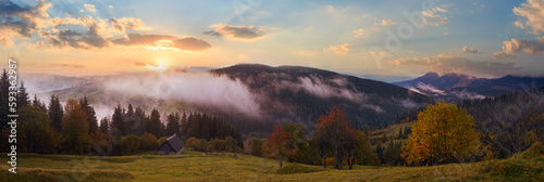 Misty early daybreak panorama in autumn Carpathian mountain, Ukraine.