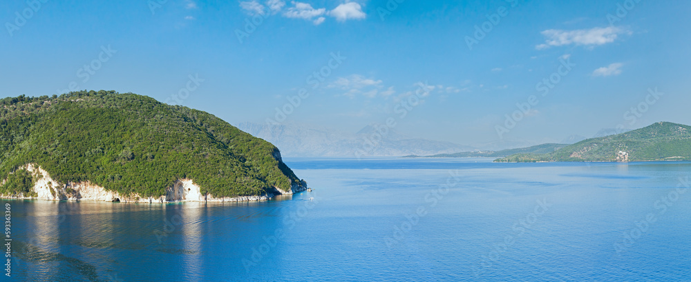 Summer Lefkada coastline panorama and sailers in bay (Nydri , Greece).