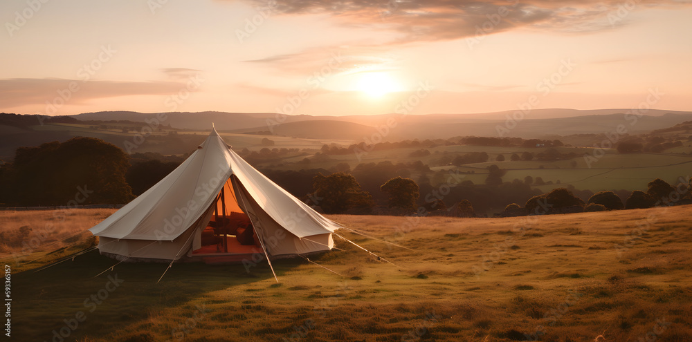 Set up on a field, with a tent in the background and a gorgeous sunset as the backdrop, witness the breathtaking beauty of nature. The ideal nature wallpaper is this scenic vista.