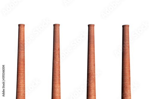 Foto Four old brick factory smokestacks isolated with cut out sky.
