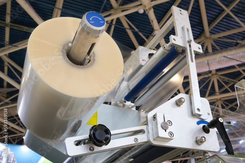 фотографія Automatic polyethylene plastic bag production machine with lighting effect