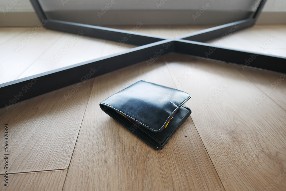 left wallet on floor at home left wallet on floor at home