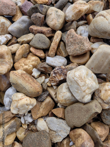 Decorative stones for the garden in shades of beige and brown.