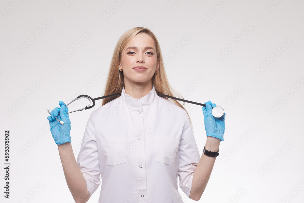 portrait of a beautiful doctor girl on a clean blue background portrait of a beautiful doctor girl on a clean blue background