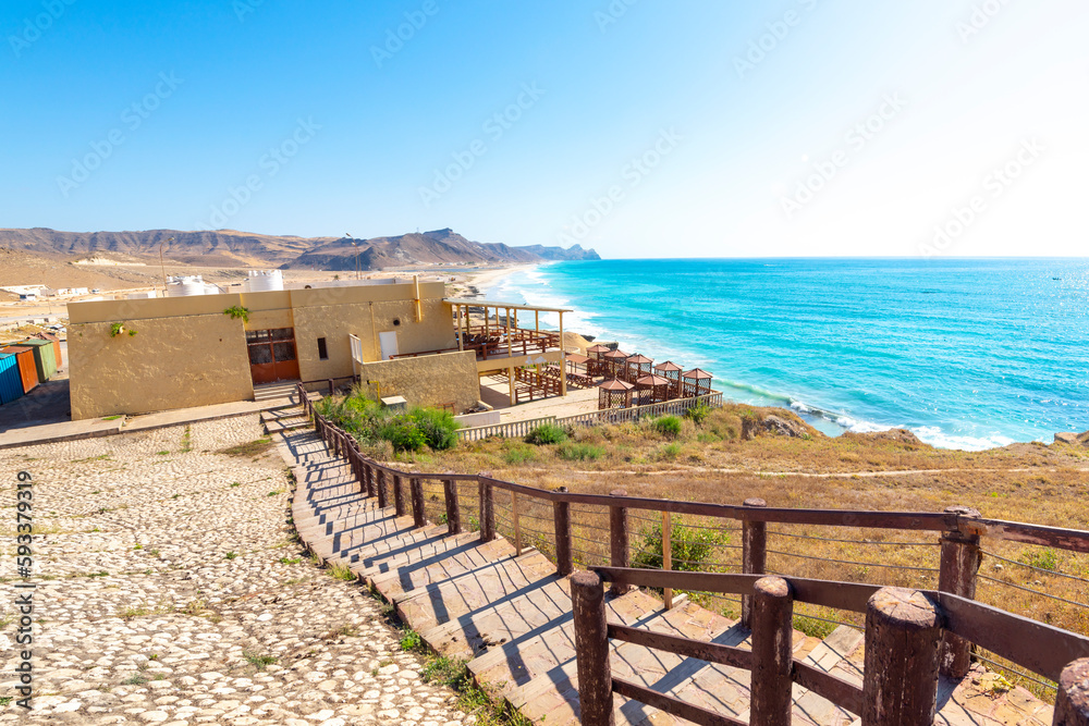 A waterfront cafe along Mughsail Beach near the Dhofar Caves along the Arabian Sea at Salalah, Oman.