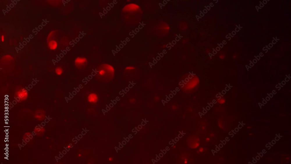 Red bokeh abstract motion background. Defocused red circles abstract movement. Shimmering Bokeh Lights. Red bokeh abstract motion background. Defocused red circles abstract movement. Shimmering Bokeh Lights.