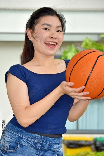 A Smiling Diverse Female Basketball Player