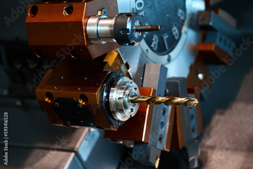 Capstan turret with drills of lathe machine at factory