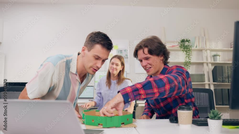 Group of businessman and woman eat pizza while working in the office. Group of businessman and woman eat pizza while working in the office.