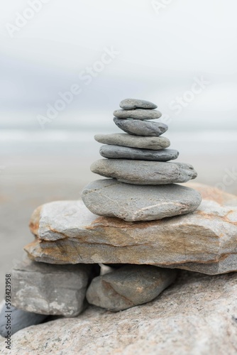 stack of stones in the beach for relaxation, and zen meditation 
