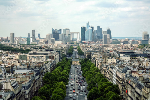 PARIS, FRANCE - JULY 11, 2011: La Defense Business district with its Arch (Grande Arche) seen from the Axe Historique, with the Avenue de la Grande Armee street in front photo