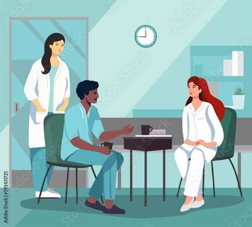 Hospital scene with diverse group of health care professionals casually chatting in a break room. Medical staff - doctors and nurses in rest pause in medical office interior