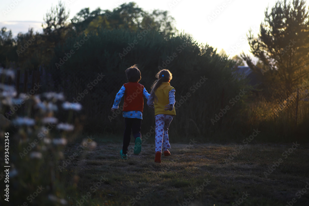 Children walk in the summer in nature. Child on a sunny spring morning in the park. Traveling with children. Children walk in the summer in nature. Child on a sunny spring morning in the park. Traveling with children.