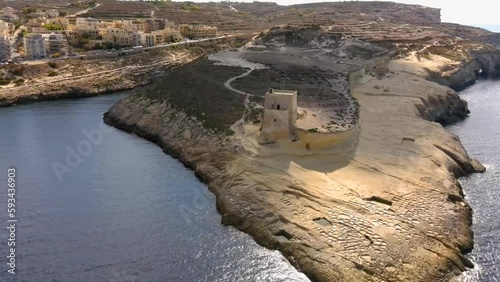 Drone shot tracking towards Xlendi Tower photo