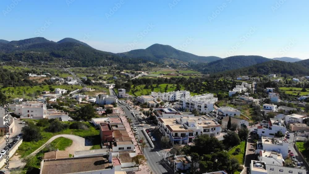 Ibiza drone rising with view over hills, fields and houses Ibiza drone rising with view over hills, fields and houses