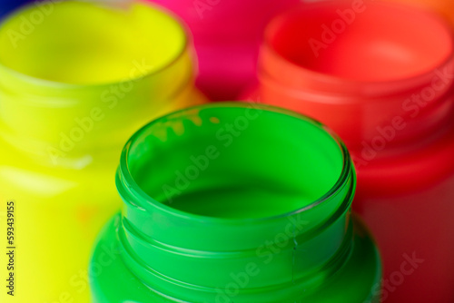 Colorful paints in pots  color palette. Art background and texture. Closeup photography.